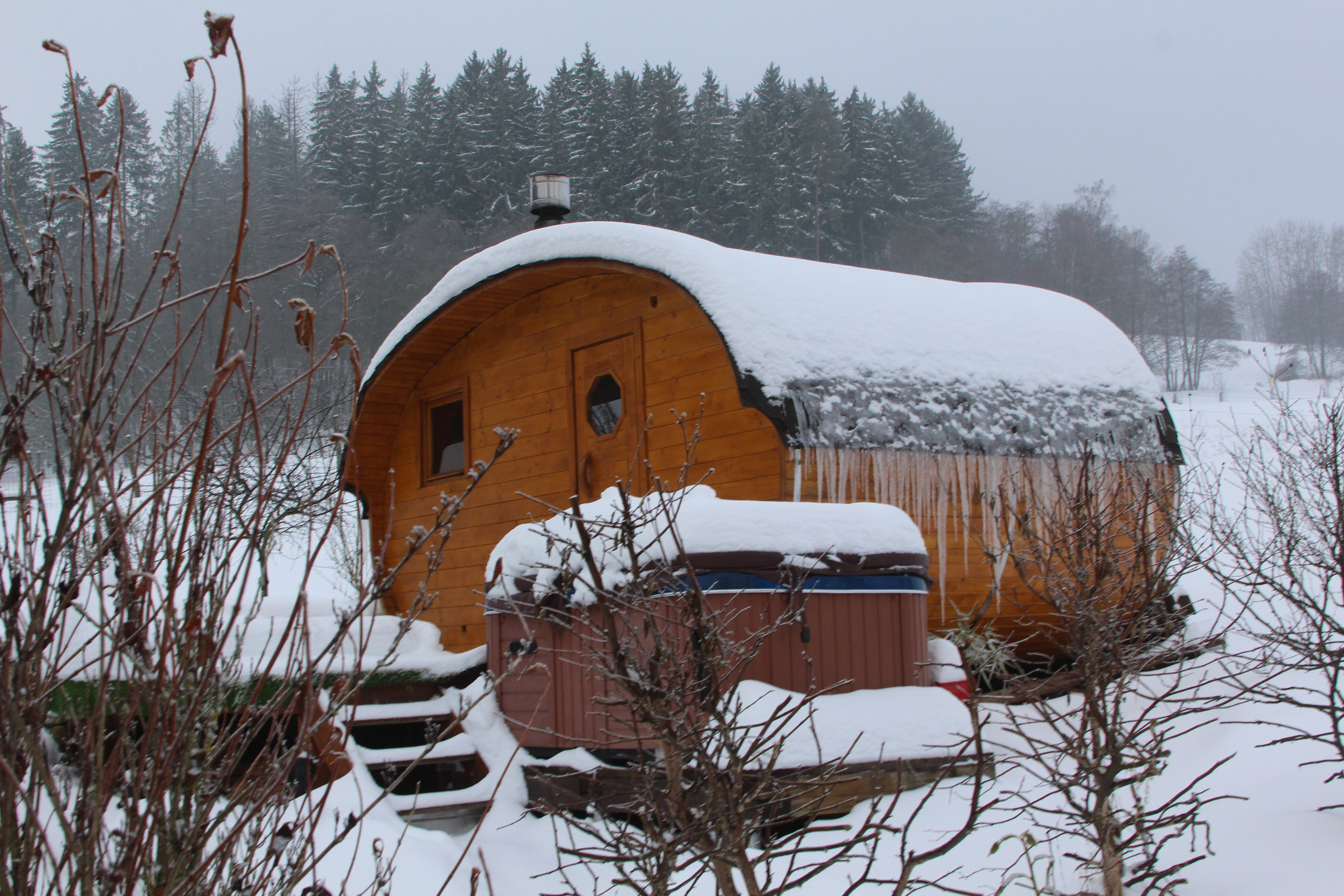 Sauna with icicles in the winter garden TMA SEMILY